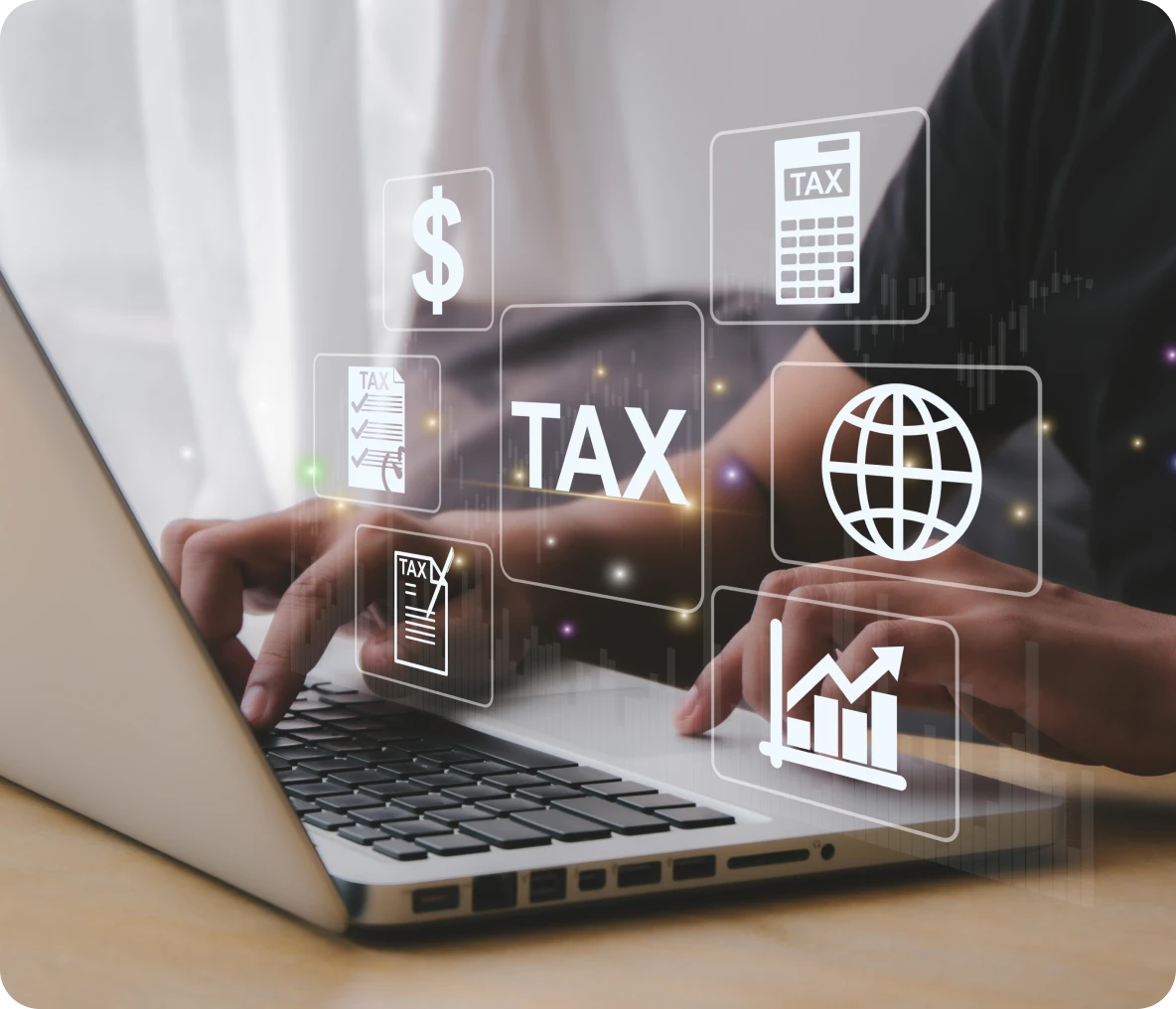 Person typing on laptop with tax icons